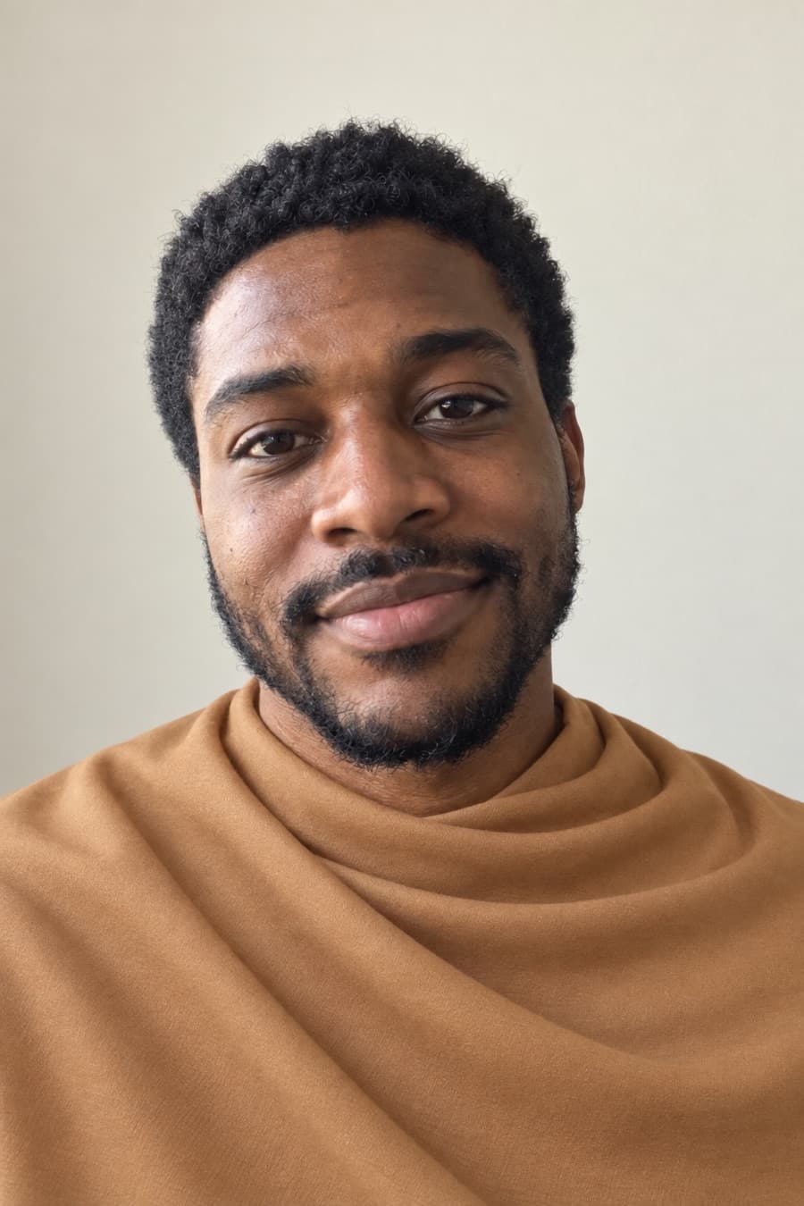 Marcus draped in warm camel, a color to avoid